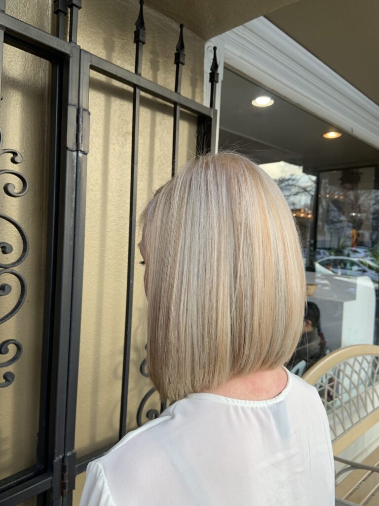 mid-length graduated bob with platinum and gold dimensional highlights